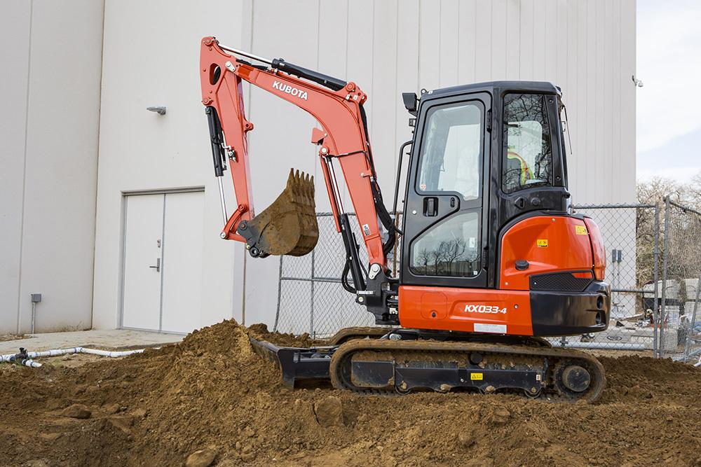 KX033-4 digging a trench