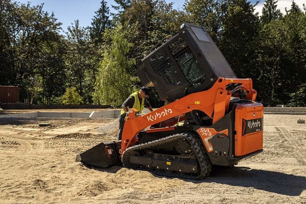 Man stepping into Skid Steer