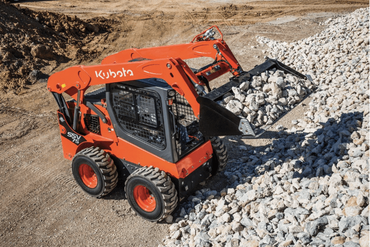 Skid Steer moving large rocks