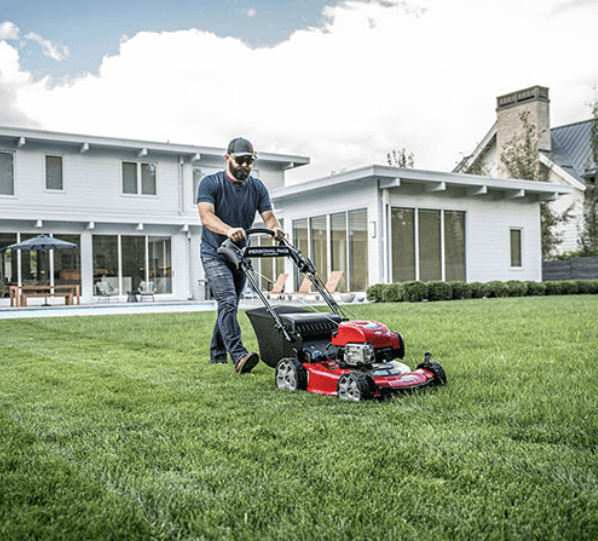 Man using a Toro push Mower