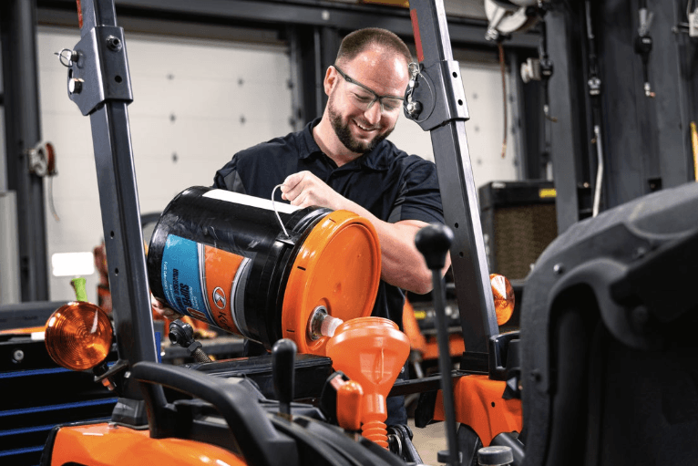 Technician changing oil