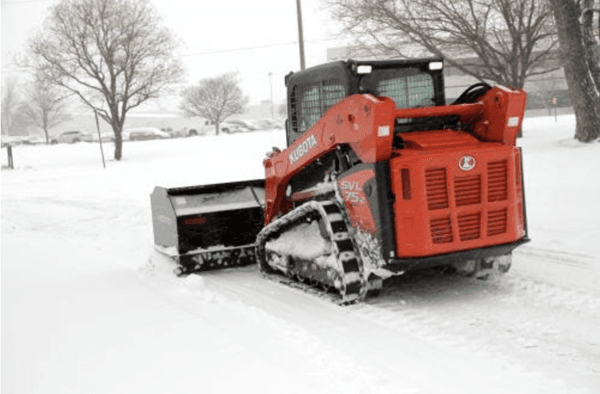Kubota Track loader using snow attachment