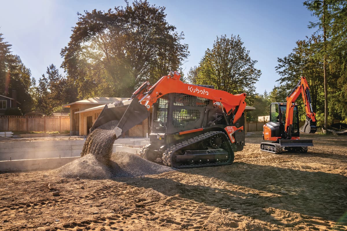 Kubota SVL75-3 dumping gravel